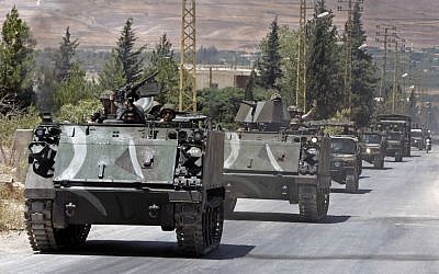 File: Lebanese Army reinforcements arrive at the outskirts of Arsal, a predominantly Sunni Muslim town near the Syrian border in eastern Lebanon, August 4, 2014. (AP/Bilal Hussein/File)