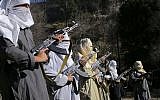 In this Sunday, Dec. 11, 2011 file photo, masked Pakistani Taliban militants take part in a training session in an area of Pakistan's tribal South Waziristan region along the Afghan border. (AP/Ishtiaq Mahsud)
