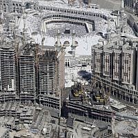 This Saturday, Oct. 27, 2012 file aerial image taken from a helicopter shows tens of thousands of Muslim pilgrims moving around the Kaaba, the black cube seen at center, inside the Grand Mosque, during the annual Hajj in the Saudi holy city of Mecca, Saudi Arabia. (photo credit: AP/Hassan Ammar)