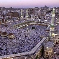 In this Monday, Feb. 18, 2002 file photo, thousands of Muslims gather around the holy Kabaa during evening prayer in the holy city of Mecca in Saudi Arabia. (photo credit: AP/Hasan Sarbakhshian)