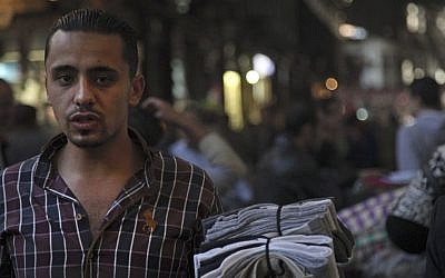 A hawker tries to sell socks in the ancient bazaar known as the Hamidiyeh souq in Damascus, Syria, Oct. 27, 2014. (photo credit: AP/Diaa Hadid) A hawker tries to sell socks in the ancient bazaar known as the Hamidiyeh souq in Damascus, Syria, Oct. 27, 2014. (photo credit: AP/Diaa Hadid)