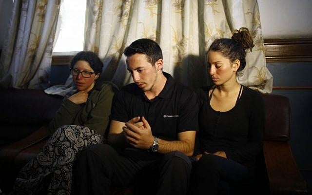 From left to right, Israeli trekkers Linor Kajan, Yakov Megreli and Maya Ora at the Army hospital in Katmandu, Nepal, Thursday, Oct. 16, 2014. (photo credit: AP/Niranjan Shrestha)