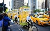 A fleet of pedi-sukkahs cruise through New York City. (Photo credit: Chabad.org / JTA)