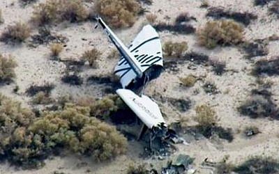 This image from video by KABC TV Los Angeles shows wreckage of what is believed to be SpaceShipTwo in Southern California's Mojave Desert on Friday, Oct. 31, 2014. A Virgin Galactic space tourism rocket exploded after taking off on a test flight, a witness said Friday. (photo credit: AP Photo/KABC TV)