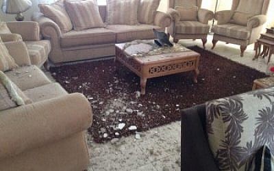 Ibrahim Barzak’s living room after it was hit by an Israeli rocket. (photo credit: Ibrahim Barzak/JTA)