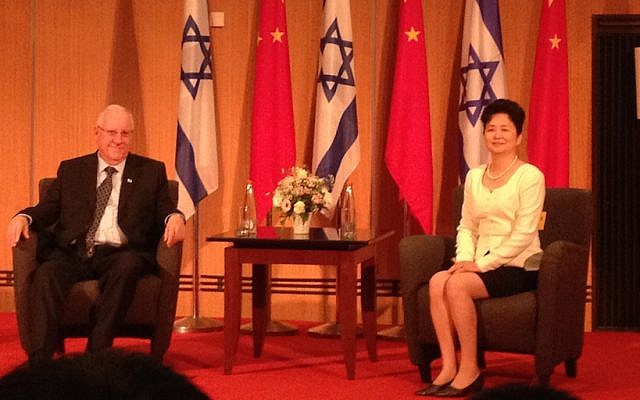 President Reuven Rivlin (R.) and China's  former Ambassador to Israel Gao Yanping at an event in Tel Aviv commemorating National Day, the 65th anniversary of the founding of modern China (Photo credit: Courtesy)