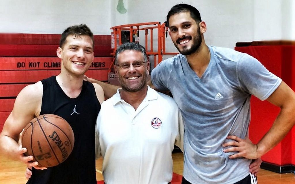 Trainer David Thorpe is flanked by two of his pupils -- Israelis Gal Mekel, left, and Omri Casspi, both playing in the NBA. (Courtesy David Thorpe/JTA) Trainer David Thorpe is flanked by two of his pupils -- Israelis Gal Mekel, left, and Omri Casspi, both playing in the NBA. (Courtesy David Thorpe/JTA)