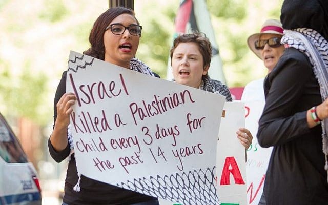 Anti-Israel protesters at a Boston rally held during Operation Protective Edge in summer 2014 (photo credit: Elan Kawesch) Anti-Israel protesters at a Boston rally held during Operation Protective Edge in summer 2014 (photo credit: Elan Kawesch)