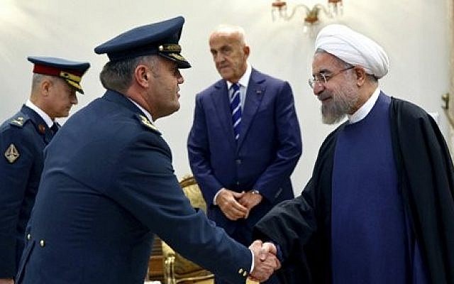 A Lebanese general (left), shakes hands with Iran's President Hassan Rouhani at his office in Tehran, Iran, Sunday, October 19, 2014. (photo credit: AP/Ebrahim Noroozi) A Lebanese general (left), shakes hands with Iran's President Hassan Rouhani at his office in Tehran, Iran, Sunday, October 19, 2014. (photo credit: AP/Ebrahim Noroozi)
