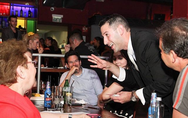 Magician Matan Rosenberg on stage at Sorcerers' Night. (photo credit: courtesy Sorcerers' Night)