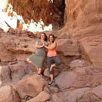Roni Friedman, an organizer of Yoga Arava with Shanee Habari, one of the yoga instructors, at Solomon's Pillars in Timna Park (photo credit: Jessica Steinberg/Times of Israel)