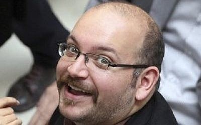 In this April 11, 2013, file photo, Jason Rezaian, an Iranian-American correspondent for the Washington Post smiles as he attends a presidential campaign of President Hassan Rouhani in Tehran, Iran. (photo credit: AP/Vahid Salemi)