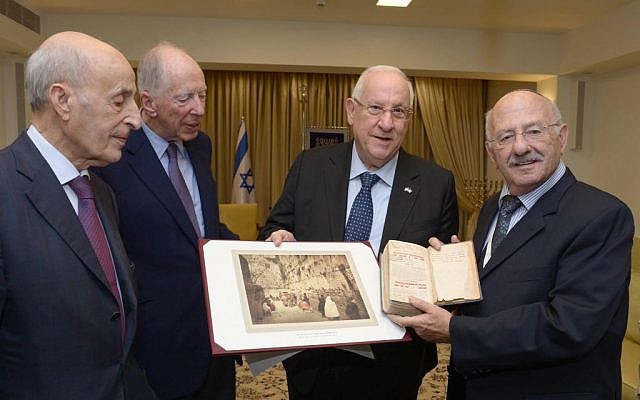 President Reuven Rivlin, second from right, returning a 200-year-old library book to the National Library of Israel. (Courtesy) President Reuven Rivlin, second from right, returning a 200-year-old library book to the National Library of Israel. (Courtesy)
