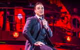 Robbie Williams in his three-piece suit, on tour (Courtesy Robbie Williams)