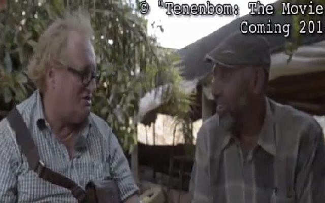 Tuvia Tennenbaum (left) interviews B'Tselem researcher Ataf Abu Rub (R) (Screen capture: Channel 2)