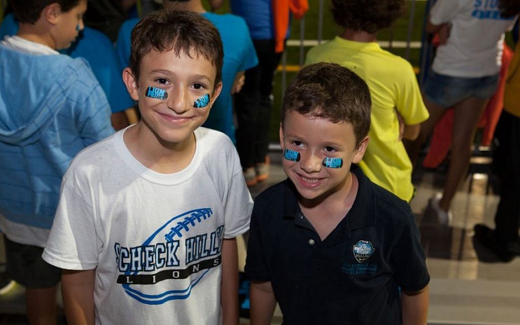 Illustrative: Students at Scheck Hillel Community Day School's homecoming football game, when its new synthetic turf field made its debut, Oct. 22, 2014. (Courtesy Scheck Hillel/JTA) Illustrative: Students at Scheck Hillel Community Day School's homecoming football game, when its new synthetic turf field made its debut, Oct. 22, 2014. (Courtesy Scheck Hillel/JTA)