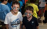 Illustrative: Students at Scheck Hillel Community Day School's homecoming football game, when its new synthetic turf field made its debut, Oct. 22, 2014. (Courtesy Scheck Hillel/JTA)