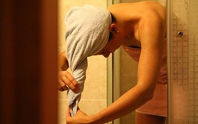 Illustrative photo of a woman drying herself after a shower. (photo credit: Yossi Zamir/Flash90)
