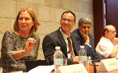 Justice Minister Tzipi Livni (left) makes a point at Israel Academy of Sciences and Humanities conference as State Prosecutor Shai Nitzan, to the immediate right, looks on. October 20, 2014. (photo credit: Michal Fattal)