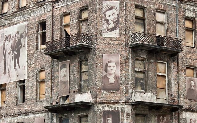 A Holocaust memorial on a building in the Warsaw ghetto via Shutterstock.