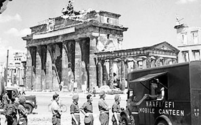 British soldiers in line for tea at NAFFI Mobile Canteen No. 750 at the Brandenburg Gate in Berlin, Germany, 16 July, 1945 (photo credit: Imperial War Museum) British soldiers in line for tea at NAFFI Mobile Canteen No. 750 at the Brandenburg Gate in Berlin, Germany, 16 July, 1945 (photo credit: Imperial War Museum)