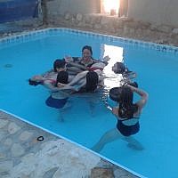 The circle of trust at water yoga in Kibbutz Lotan (photo credit: Irit Einav)