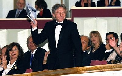 Film director Roman Polanski  waving as he attends a gala concert at the Grand Theatre - National Opera in Warsaw, Poland, on October 27, 2014. (photo credit: AFP PHOTO / PAP/ RADEK PIETRUSZKA)