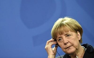 German Chancellor Angela Merkel attends a joint press conference with Belgian Prime Minister at the chancellery in Berlin, on November 21, 2014. (Photo credit: AFP / ODD ANDERSEN)