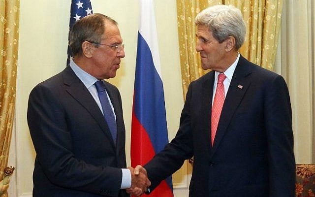 US Secretary of State John Kerry (R) and Russian Foreign Minister Sergei Lavrov shake hands prior to a bilateral meeting on the sidelines of the nuclear talks with Iran at the Palais Coburg in Vienna on November 23, 2014. (photo credit: AFP/POOL/ RONALD ZAK) US Secretary of State John Kerry (R) and Russian Foreign Minister Sergei Lavrov shake hands prior to a bilateral meeting on the sidelines of the nuclear talks with Iran at the Palais Coburg in Vienna on November 23, 2014. (photo credit: AFP/POOL/ RONALD ZAK)