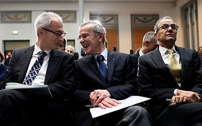 File: (L-R) Swiss politician Bernhard Pulver, Christoph Schaeublin, president of the Foundation of the Museum of Fine Arts in Bern, Swiss diplomat Tim Guldimann attend a press conference on the late German Cornelius Gurlitt 's looted Nazi-era art collection on November 24, 2014 in Berlin. (photo credit: AFP/RONNY HARTMANN)