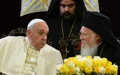 Pope Francis (L) speaks with Ecumenical Patriarch Bartholomew I after they signed a joint statement at St George church, on November 30, 2014 in Istanbul as part of a three day visit in Turkey. (photo credit: AFP / FILIPPO MONTEFORTE)