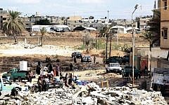 Egyptian families collect their belongings as they leave their houses during a military operation in the Egyptian city of Rafah, near the border with the southern Gaza Strip, on October 30, 2014. (photo credit: AFP/STR)