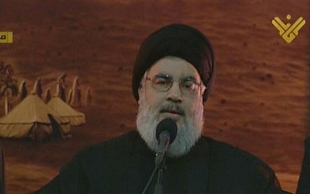 An image grab from Hezbollah's al-Manar TV shows Hassan Nasrallah giving a speech in a rare public appearance, Beirut, November 3, 2014. (photo credit: AFP/al-Manar) An image grab from Hezbollah's al-Manar TV shows Hassan Nasrallah giving a speech in a rare public appearance, Beirut, November 3, 2014. (photo credit: AFP/al-Manar)