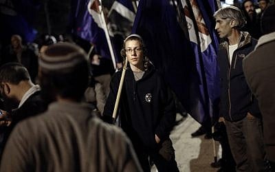 Jewish protesters  gather on November 6, 2014 near the Old City of Jerusalem, at the site where a Palestinian man recently tried to assassinate a campaigner for Jewish prayer rights  at the Temple Mount. (photo credit: AFP PHOTO/THOMAS COEX)