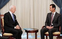 A picture released by the Syrian Arab News Agency (SANA) shows Syrian President Bashar al-Assad (R) meeting with United Nations special envoy for Syria Staffan de Mistura in Damascus on November 10, 2014. (Photo Credit: AFP PHOTO/HO/ SANA)