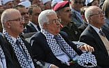 PA President Mahmoud Abbas and PA Prime Minister Rami Hamdallah during a ceremony to mark the tenth anniversary of the death of late Palestinian leader Yasser Arafat in the West Bank city of Ramallah on November 11, 2014. (photo credit: AFP PHOTO / ABBAS MOMANI)