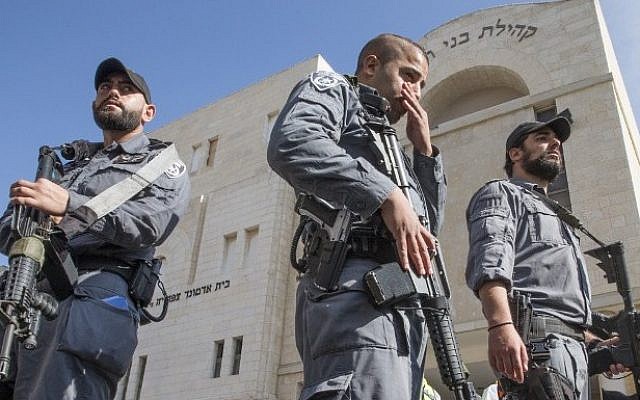 Police outside a Jerusalem synagogue after a terror attack on November 18, 2014. (photo credit: AFP/JACK GUEZ) Police outside a Jerusalem synagogue after a terror attack on November 18, 2014. (photo credit: AFP/JACK GUEZ)