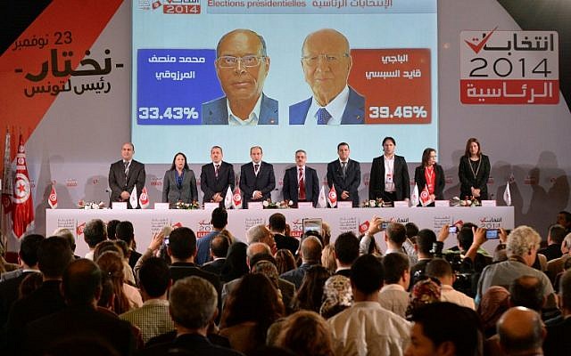Members of the Tunisian ISIE elections body hold a press conference to announce the results of the first round of the presidential election on November 25, 2014. (photo credit: AFP/FADEL SENNA) Members of the Tunisian ISIE elections body hold a press conference to announce the results of the first round of the presidential election on November 25, 2014. (photo credit: AFP/FADEL SENNA)