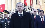 Turkish President Tayyip Erdogan (C) walks with Prime Minister Davutoglu (R) in Ankara, November 10, 2014. (AFP/Adem Altan)