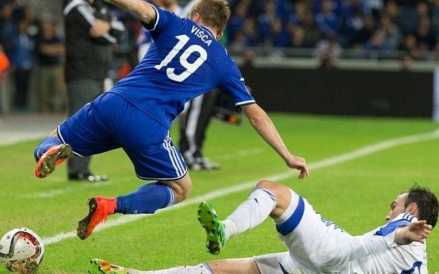 Israel's midfielder Bibras Natcho (R) vies for the ball with Bosnia-Herzegovina's midfielder Edin Visca (L) during a UEFA 2016 European Championship qualifying group B football match between Israel and Bosnia-Herzegovina on November 16, 2014. Photo credit: AFP / JACK GUEZ) Israel's midfielder Bibras Natcho (R) vies for the ball with Bosnia-Herzegovina's midfielder Edin Visca (L) during a UEFA 2016 European Championship qualifying group B football match between Israel and Bosnia-Herzegovina on November 16, 2014. Photo credit: AFP / JACK GUEZ)