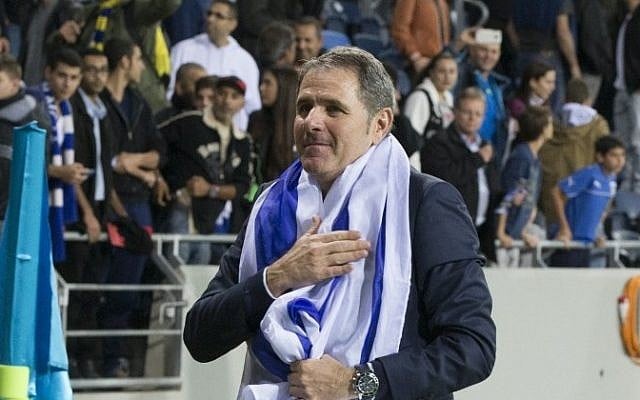Israel's head coach Elie Guttman celebrates after his team won the UEFA 2016 European Championship qualifying group B football match between Israel and Bosnia-Herzegovina at the Sammy Ofer Stadium, on November 16, 2014 in Haifa. (Photo credit: AFP/ JACK GUEZ) Israel's head coach Elie Guttman celebrates after his team won the UEFA 2016 European Championship qualifying group B football match between Israel and Bosnia-Herzegovina at the Sammy Ofer Stadium, on November 16, 2014 in Haifa. (Photo credit: AFP/ JACK GUEZ)