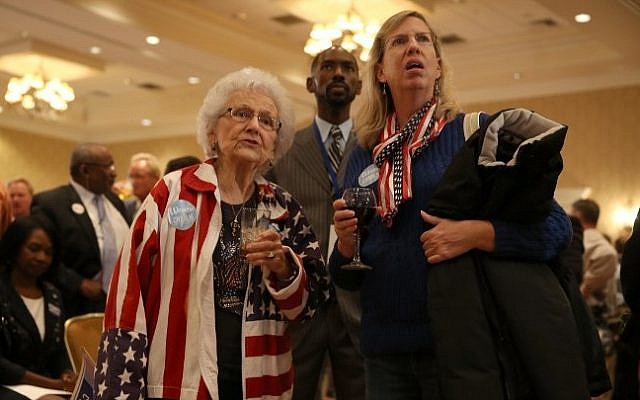 Marguerite Dawson (L) and Karen Sherrets attend the election night party for former Florida Governor and now Democratic gubernatorial candidate Charlie Crist as they watch a television screen showing early returns at the Vinoy hotel on November 4, 2014 in St. Petersburg, Florida. Crist is facing off against incumbent Republican Governor Rick Scott. (Photo credit: Joe Raedle/Getty Images/AFP) Marguerite Dawson (L) and Karen Sherrets attend the election night party for former Florida Governor and now Democratic gubernatorial candidate Charlie Crist as they watch a television screen showing early returns at the Vinoy hotel on November 4, 2014 in St. Petersburg, Florida. Crist is facing off against incumbent Republican Governor Rick Scott. (Photo credit: Joe Raedle/Getty Images/AFP)