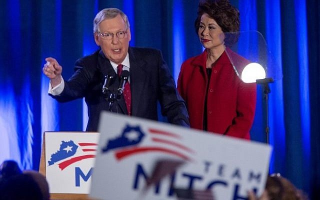 US Sen. Mitch McConnell (R-KY) speaks accompanied by his wife Elaine Chao at his election night event November 4, 2014 in Louisville, Kentucky (Photo credit: Aaron P. Bernstein/Getty Images/AFP) US Sen. Mitch McConnell (R-KY) speaks accompanied by his wife Elaine Chao at his election night event November 4, 2014 in Louisville, Kentucky (Photo credit: Aaron P. Bernstein/Getty Images/AFP)
