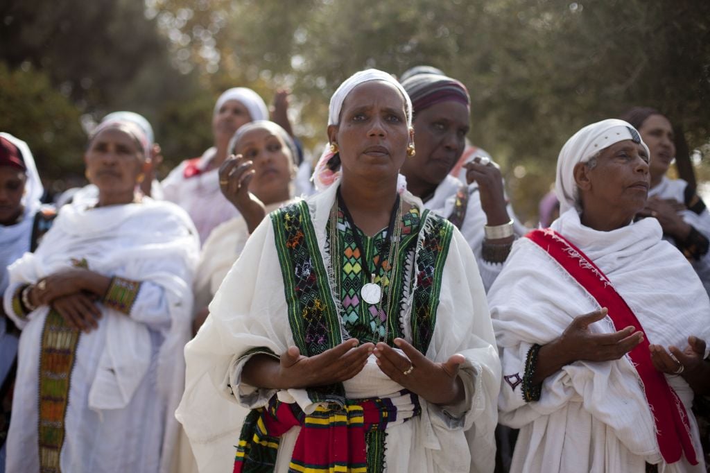 Sigd celebrants usually dress in white to symbolize purity and the acceptance of the Torah (photo credit: Flash 90)