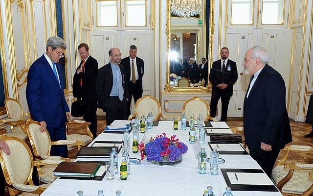 US Secretary of State John Kerry prepares to sit down with Iranian Foreign Minister Mohammad Javad Zarif in Vienna, Austria, on July 14, 2014. (photo credit: US State Department)