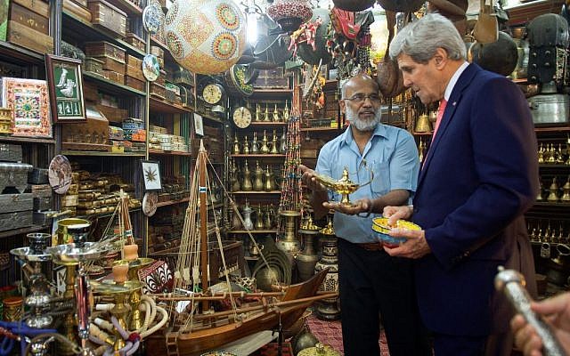 A shopkeeper offers an oil lamp to US Secretary of State John Kerry as he visits the Muttrah Souk in Muscat, Oman, on November 10, 2014. (photo credit: State Department) A shopkeeper offers an oil lamp to US Secretary of State John Kerry as he visits the Muttrah Souk in Muscat, Oman, on November 10, 2014. (photo credit: State Department)