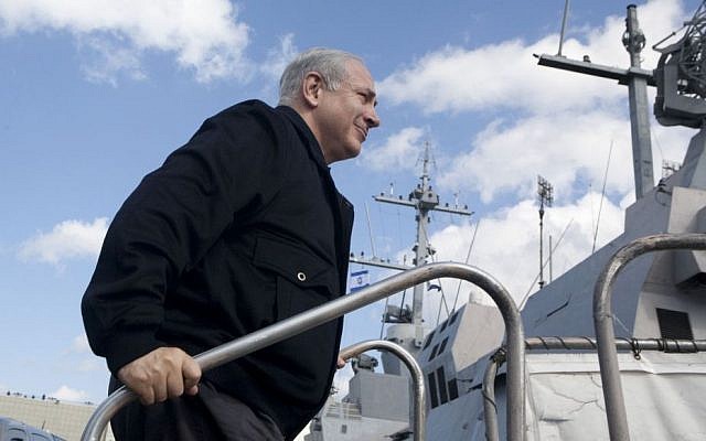 Prime Minister Benjamin Netanyahu boards the INS Eilat, on a visit to Haifa, Nov. 17, 2009. (photo credit: AP Photo/ Pavel Wolberg, Pool)