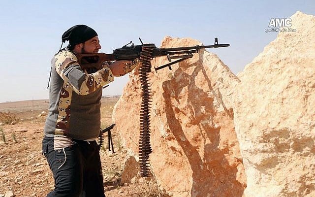 A Free Syrian Army fighter aims his weapon during a battle with Syrian government forces in Aleppo, Syria, Friday, Oct. 3, 2014 Photo credit: AP/Aleppo Media Center AMC) A Free Syrian Army fighter aims his weapon during a battle with Syrian government forces in Aleppo, Syria, Friday, Oct. 3, 2014 Photo credit: AP/Aleppo Media Center AMC)