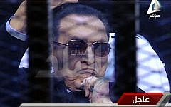 Ousted Egyptian President Hosni Mubarak sits in the defendant cage during his trial at a court in Cairo, Egypt, Saturday, Nov. 29. (Photo credit: AP/Sada el-Balad via Egypt's State Television)