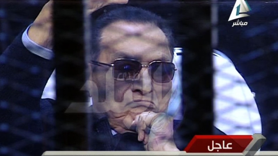 Ousted Egyptian President Hosni Mubarak sits in the defendant cage during his trial at a court in Cairo, Egypt, Saturday, Nov. 29. (Photo credit: AP/Sada el-Balad via Egypt's State Television) Ousted Egyptian President Hosni Mubarak sits in the defendant cage during his trial at a court in Cairo, Egypt, Saturday, Nov. 29. (Photo credit: AP/Sada el-Balad via Egypt's State Television)